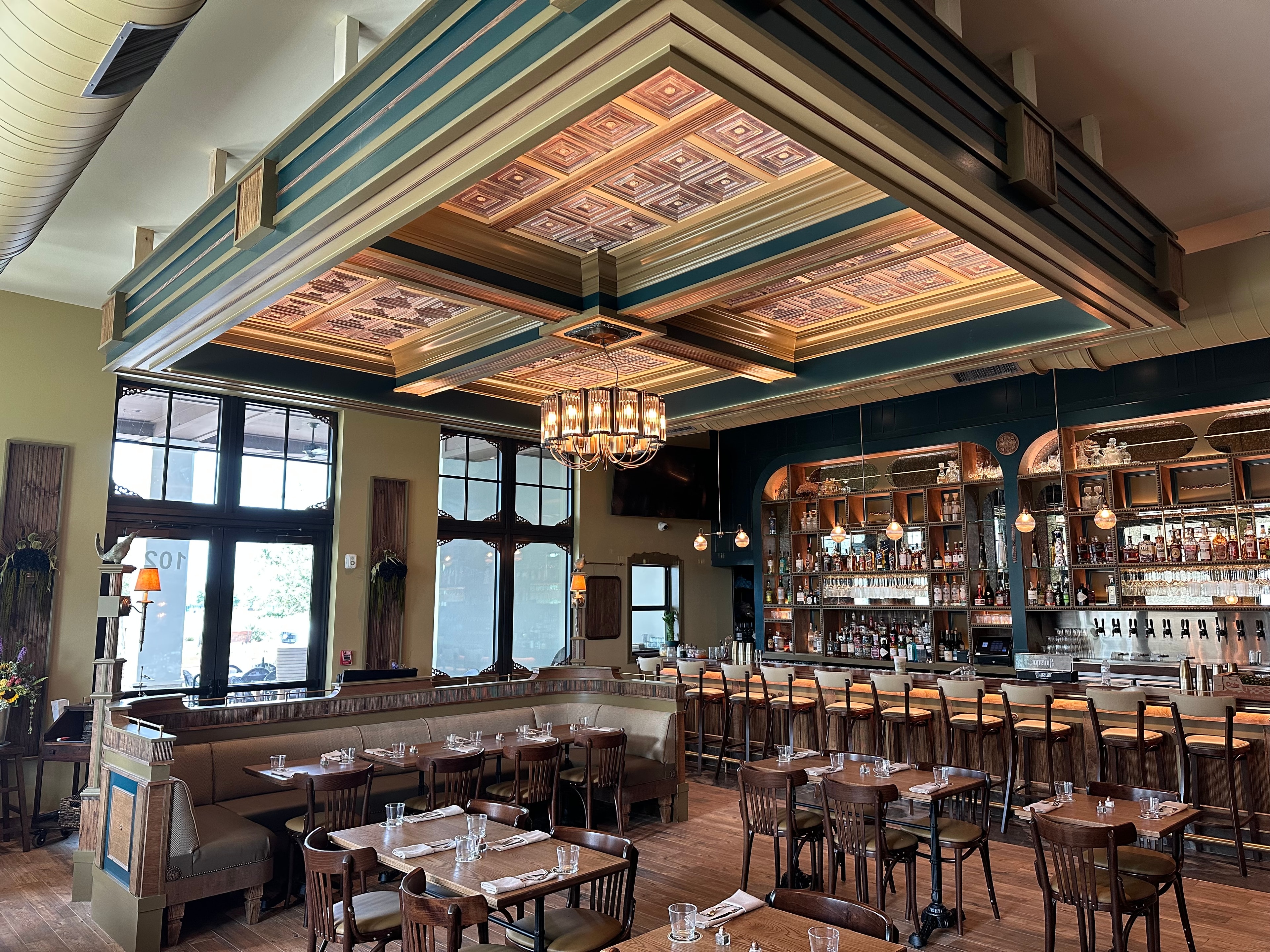 Upscale restaurant bar interior with coffered ceiling
