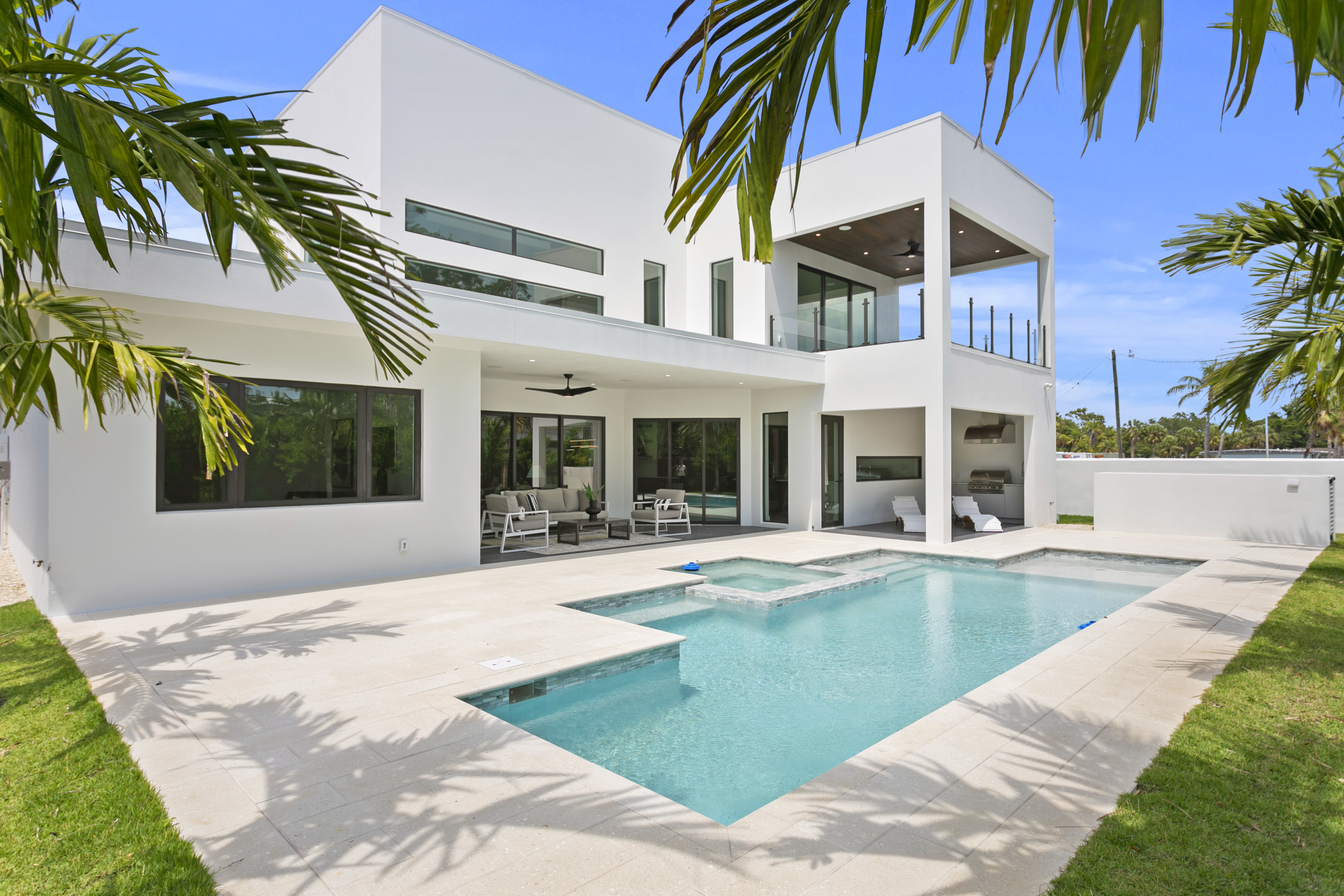 Luxury home exterior with pool and outdoor living